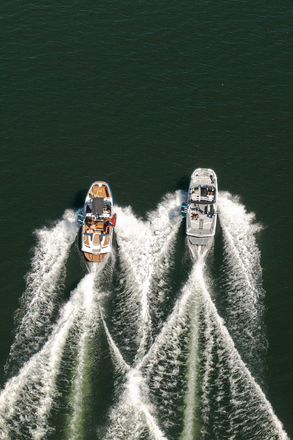 Overhead shot of two speedboats and their wake on Lake Okanagan